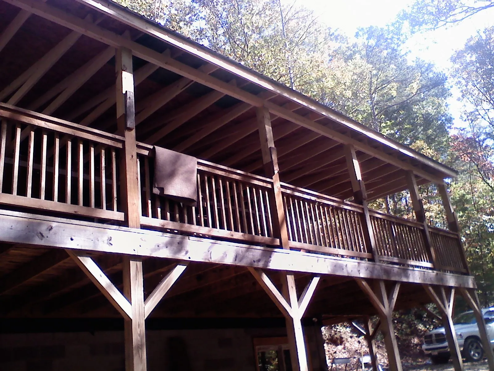 Timber framing under a new elevated porch and deck — Roof Leak Repair in Williamston by Roofing Brothers